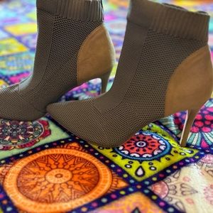 Navy green heeled boots with tan